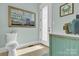 Quaint half-bath with tiled floors, framed mirror, and blue and white accents at 141 Castle Dr, Mooresville, NC 28117