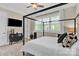 Stylish bedroom featuring a four poster bed, modern decor, and a large window offering natural light at 141 Castle Dr, Mooresville, NC 28117