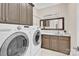 Convenient laundry room with modern appliances, custom cabinets, and a stylish countertop at 141 Castle Dr, Mooresville, NC 28117