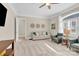 Bright living room with neutral tones, stylish furnishings, and a large window providing plenty of natural light at 141 Castle Dr, Mooresville, NC 28117