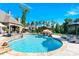 Spacious backyard pool with outdoor kitchen, gazebo, poolside seating, and surrounding landscaping at 141 Castle Dr, Mooresville, NC 28117