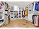 Spacious walk-in closet featuring custom built-in shelving and hardwood floors for optimal storage and organization at 141 Castle Dr, Mooresville, NC 28117