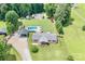 Aerial view of property showing in-ground pool, shed, carport and lovely home with landscaped front porch at 1489 L R Schronce Ln, Iron Station, NC 28080