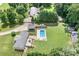 This home features a pool, car port, deck, RV parking, and expansive lawn at 1489 L R Schronce Ln, Iron Station, NC 28080