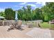 Outdoor oasis: a spacious back deck overlooks a lush yard and inviting pool at 1489 L R Schronce Ln, Iron Station, NC 28080