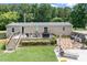 Back of home featuring a wooden deck with an umbrella and outdoor seating at 1489 L R Schronce Ln, Iron Station, NC 28080