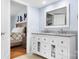 Modern bathroom with double sink vanity, granite countertops and view into bedroom at 1489 L R Schronce Ln, Iron Station, NC 28080