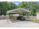 A car parked under a metal carport structure with a gravel base at 1489 L R Schronce Ln, Iron Station, NC 28080