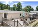Wooden deck with stairs, outdoor seating, and a grill overlooking the backyard at 1489 L R Schronce Ln, Iron Station, NC 28080