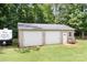 Detached two car garage with a metal roof and two roll-up doors at 1489 L R Schronce Ln, Iron Station, NC 28080
