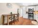 Charming kitchen with stainless steel appliances, white cabinetry and breakfast bar with seating at 1489 L R Schronce Ln, Iron Station, NC 28080
