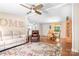 Open-concept living area with hardwood floors, neutral decor, and seamless flow into the dining area at 1489 L R Schronce Ln, Iron Station, NC 28080