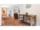 Open concept living area with wood floors, pool view, and cozy seating at 1489 L R Schronce Ln, Iron Station, NC 28080