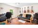 Versatile room with guitars on wall, futon, hardwood floors, and natural light at 1489 L R Schronce Ln, Iron Station, NC 28080