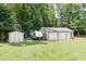 Outbuildings provide ample storage and workspace, with room to park an RV at 1489 L R Schronce Ln, Iron Station, NC 28080