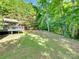 Lush backyard with a covered deck, offering a serene outdoor retreat with plenty of room to enjoy at 1529 Covenant Pl, Rock Hill, SC 29732
