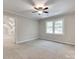 A bright bedroom featuring neutral carpet, a ceiling fan, and good natural light at 1529 Covenant Pl, Rock Hill, SC 29732