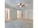 Large bedroom with neutral paint, carpeted floors, ceiling fan, and white closet doors at 1529 Covenant Pl, Rock Hill, SC 29732