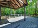 Covered deck featuring wood railing, perfect for enjoying the outdoors in shade and privacy at 1529 Covenant Pl, Rock Hill, SC 29732