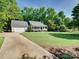 Exterior view of home with front porch, large front lawn and mature shade trees at 1529 Covenant Pl, Rock Hill, SC 29732