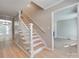 Inviting foyer with hardwood floors and a staircase with a white railing at 1529 Covenant Pl, Rock Hill, SC 29732