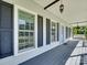 A relaxing front porch featuring stylish windows and shutters at 1529 Covenant Pl, Rock Hill, SC 29732
