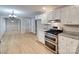 Open kitchen with stainless steel appliances, double oven, granite counters, and hardwood floors at 1529 Covenant Pl, Rock Hill, SC 29732