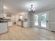 Bright kitchen featuring white cabinets, stainless steel appliances, and hardwood floors, perfect for cooking at 1529 Covenant Pl, Rock Hill, SC 29732