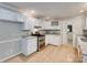Kitchen with white cabinets, granite countertops, stainless steel appliances, and hardwood floors at 1529 Covenant Pl, Rock Hill, SC 29732