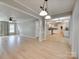 Open-concept living room showcasing hardwood floors, natural light, and seamless flow into the kitchen at 1529 Covenant Pl, Rock Hill, SC 29732