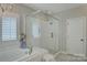 Spa-like bathroom features a luxurious soaking tub and a glass-enclosed shower with white subway tile at 17537 Caddy Ct, Charlotte, NC 28278
