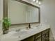 Elegant bathroom boasting double sinks, sleek vanity, and a large, decorative mirror at 17537 Caddy Ct, Charlotte, NC 28278