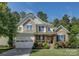 Charming two-story home boasts stone accents, a welcoming front porch, and a well-manicured lawn at 17537 Caddy Ct, Charlotte, NC 28278