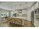 Modern kitchen featuring an island with bar seating, stainless steel appliances, and white cabinetry at 17537 Caddy Ct, Charlotte, NC 28278