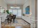 Bright living room with a piano, large windows, and elegant decor at 17537 Caddy Ct, Charlotte, NC 28278