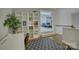 Bright office area with white shelves and open view to living area at 17537 Caddy Ct, Charlotte, NC 28278