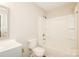 Bright bathroom features a shower-tub combo, white toilet, and vanity with light grey drawers and cabinet at 201 Killian Cir, Clover, SC 29710
