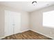 A well-lit bedroom features a closet, wood flooring, and a modern paint scheme at 201 Killian Cir, Clover, SC 29710