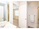 Bright bathroom view showcasing double vanity and access to the bedroom at 2019 Heirloom Ct, Matthews, NC 28104
