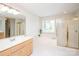 Bright primary bathroom with double vanity, shower, and soaking tub at 2019 Heirloom Ct, Matthews, NC 28104