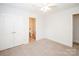 Bedroom featuring double closets, a ceiling fan, and neutral carpet at 2019 Heirloom Ct, Matthews, NC 28104