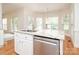 Kitchen island with stainless steel dishwasher and granite countertops at 2019 Heirloom Ct, Matthews, NC 28104
