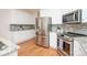 Well-appointed kitchen featuring granite countertops, stainless steel appliances, and white cabinetry at 2019 Heirloom Ct, Matthews, NC 28104
