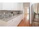 Bright kitchen with granite countertops, tile backsplash, and ample cabinet space at 2019 Heirloom Ct, Matthews, NC 28104