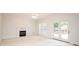 Cozy living room featuring a marble fireplace and access to the outdoor patio at 2019 Heirloom Ct, Matthews, NC 28104