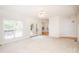 Bright living room with access to outdoor patio and views into dining room at 2019 Heirloom Ct, Matthews, NC 28104