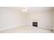 Bright living room features a fireplace, ceiling fan, and neutral carpet at 2019 Heirloom Ct, Matthews, NC 28104