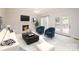 Cozy living room with fireplace, comfortable seating, and access to the outdoor patio and hot tub at 2019 Heirloom Ct, Matthews, NC 28104