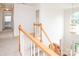 Bright stairway with carpet and natural wood accents at 2019 Heirloom Ct, Matthews, NC 28104