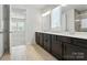 Well-lit bathroom with a double vanity, modern fixtures, and a separate shower area at 231 Cotton Ridge Pl, Rock Hill, SC 29730